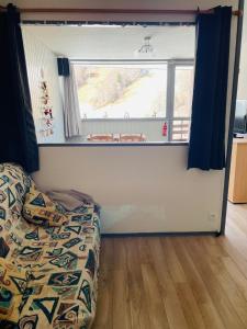 En eller flere senge i et værelse på Studio pied de pistes Tour de la Biche