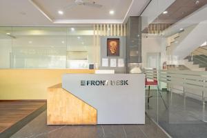 a store with a front desk in a building at CS Luxurio Presendential Suites Gachibowli in Hyderabad