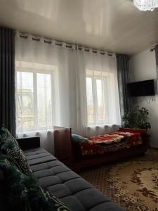 Et opholdsområde på Tilek Guest House + 17 billeder