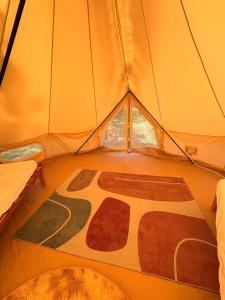 a room with a rug in a tent at The Lighthouse - Eco-Village & Wellness in Koh Tao +41 photos