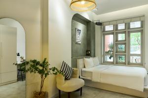 En eller flere senge i et værelse på Kin Wander Tân Quy