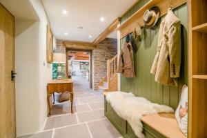 a hallway with green walls and a staircase in a house at 3 Bed in Dulas oc-g34082 in Longtown