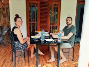 a man and a woman sitting at a table at Yala Eagle Nest and Safari in Tissamaharama +61 photos