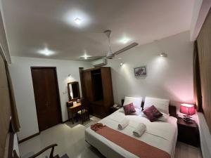 En eller flere senge i et værelse på De Mansion Hotels + 30 billeder