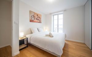 Postel nebo postele na pokoji v ubytování Paradis au bord de saone