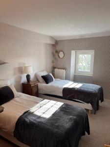 Postel nebo postele na pokoji v ubytování Demeure de Malaville + 19 fotografií