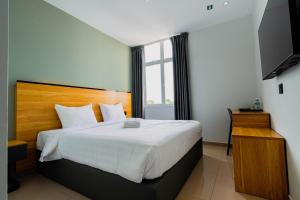 Giường trong phòng chung tại Hotel M9 Sepang KLIA & KLIA 2