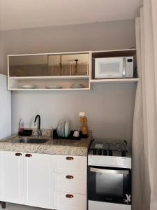 Køkken eller tekøkken på Flat Centro Barra Grande + 3 billeder