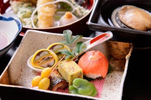 a tray of food with different types of food at 賢島の宿みち潮 Kashikojima no yado Michishio in Shima
