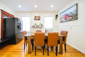 a kitchen with a dining room table and chairs at Cozy 3BR Worcester 1st-floor Apt, Pet-Friendly, Near Clark University, Free Parking 4-1 in Worcester