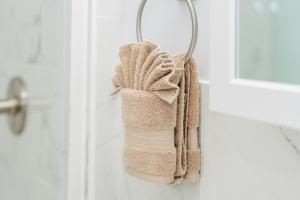 a towel is hanging on a door at Cozy 3BR Worcester 1st-floor Apt, Pet-Friendly, Near Clark University, Free Parking 4-1 in Worcester +61 photos