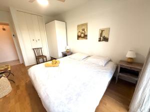 a bedroom with a large bed with a teddy bear on it at t3 cagnes sur mer in Cagnes-sur-Mer +16 photos