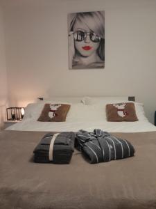 a bedroom with two beds with a woman wearing glasses at San's resort in Vionnaz