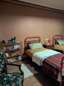 Giường trong phòng chung tại La Maison de Marie