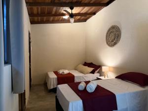 En eller flere senge i et værelse på Casa Holy Ubatuba - Hospedagem Holística + 29 billeder