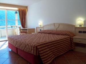 En eller flere senge i et værelse på Residence Club La Betulla