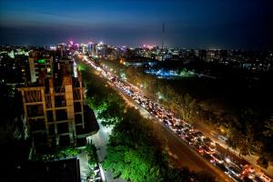 a city street filled with lots of traffic at night at Best Western Plus Maple Leaf in Dhaka