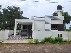 a white house with a person sitting inside of it at Golden in Kaup +16 photos