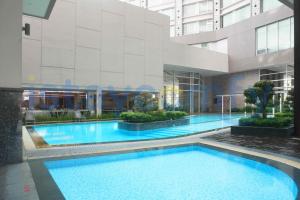 a large swimming pool in the middle of a building at Studio Aston Residence 0306 City View in Nagoya