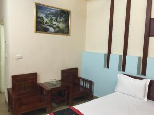 Postel nebo postele na pokoji v ubytování Sunrise Hotel