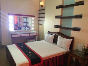 Postel nebo postele na pokoji v ubytování Sunrise Hotel
