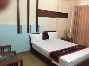 Postel nebo postele na pokoji v ubytování Sunrise Hotel