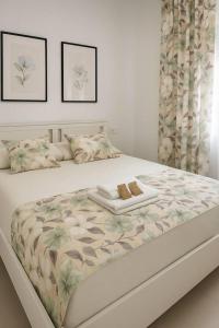 Giường trong phòng chung tại Alojamiento Baeza California 2A