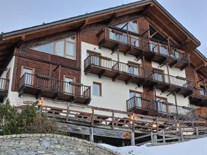 a building with balconies on the side of it at Residence Cianfuran in Bardonecchia