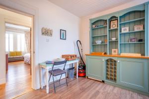 a room with a desk and a table with a chair at Overton - Elie in Elie