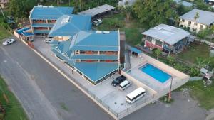 an overhead view of a house with a swimming pool at Nambis Inn in Madang