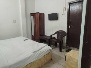 En eller flere senge i et værelse på Hotel O Vip Stay Inn