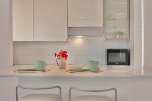 Kuchyň nebo kuchyňský kout v ubytování [porto santo stefano] vista mare + parcheggio gratuito