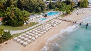 an aerial view of a beach with umbrellas and chairs at HVD Nympha Hotel - Adults Only - Private Beach & Free Parking in Golden Sands +34 photos