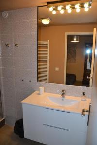 a bathroom with a sink and a mirror at Villa Maredda in La Ciotat