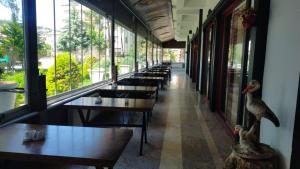 a row of tables and benches in a restaurant at Vanna Hotel Spa in Hamamözü