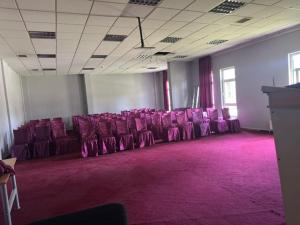 a row of purple chairs sitting in a room at Vanna Hotel Spa in Hamamözü +13 photos
