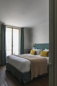 En eller flere senge i et værelse på HOY Paris - Yoga Hotel + 43 billeder
