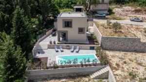 an aerial view of a house with a swimming pool at Villa D Cube by Villas Guide in Duba