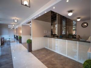a lobby with a bar in a building at Hotel SPICH - Pearl Beach Resort in Čanj +39 photos