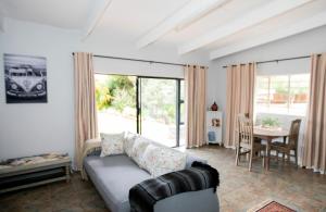 a living room with a couch and a table at Buchan's Corner Unit 2 in Hartbeespoort