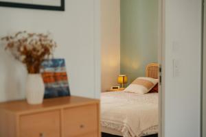 En eller flere senge i et værelse på Maison à 1300 m des plages