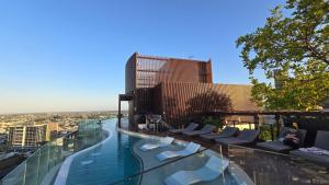 a swimming pool on the top of a building at FV 1BR APT with Rooftop Pool in Brisbane