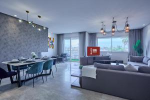 a living room with a couch and a table at Spacious 3BR 174m2 Quiet Residential Casablanca in Casablanca