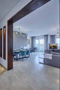 a living room with a table and a couch at Spacious 3BR 174m2 Quiet Residential Casablanca in Casablanca
