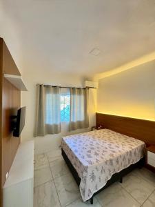 Postel nebo postele na pokoji v ubytování Casa 700m do mar Penha SC