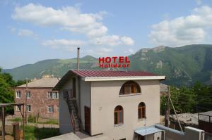 un cartello hotel Hilton in cima a un edificio di Hotel Halidzor a Halidzor
