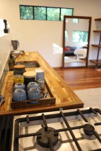 a kitchen with a stove and a counter top at Beautiful high-set studio close to beach in Ocean Shores