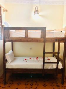 Postel nebo postele na pokoji v ubytování Rafiki Zanzibar Residence + 11 fotografií