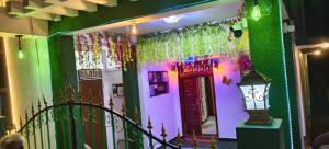 a house with a colorful front door with a lamp at Le Green House Villa in Pondicherry