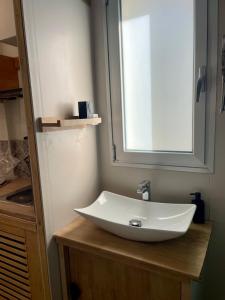 a bathroom sink with a window on top of it at casa kayla in Palm-Mar +8 photos